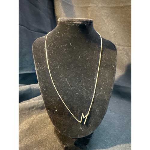 Gold tone initial letter - tone,